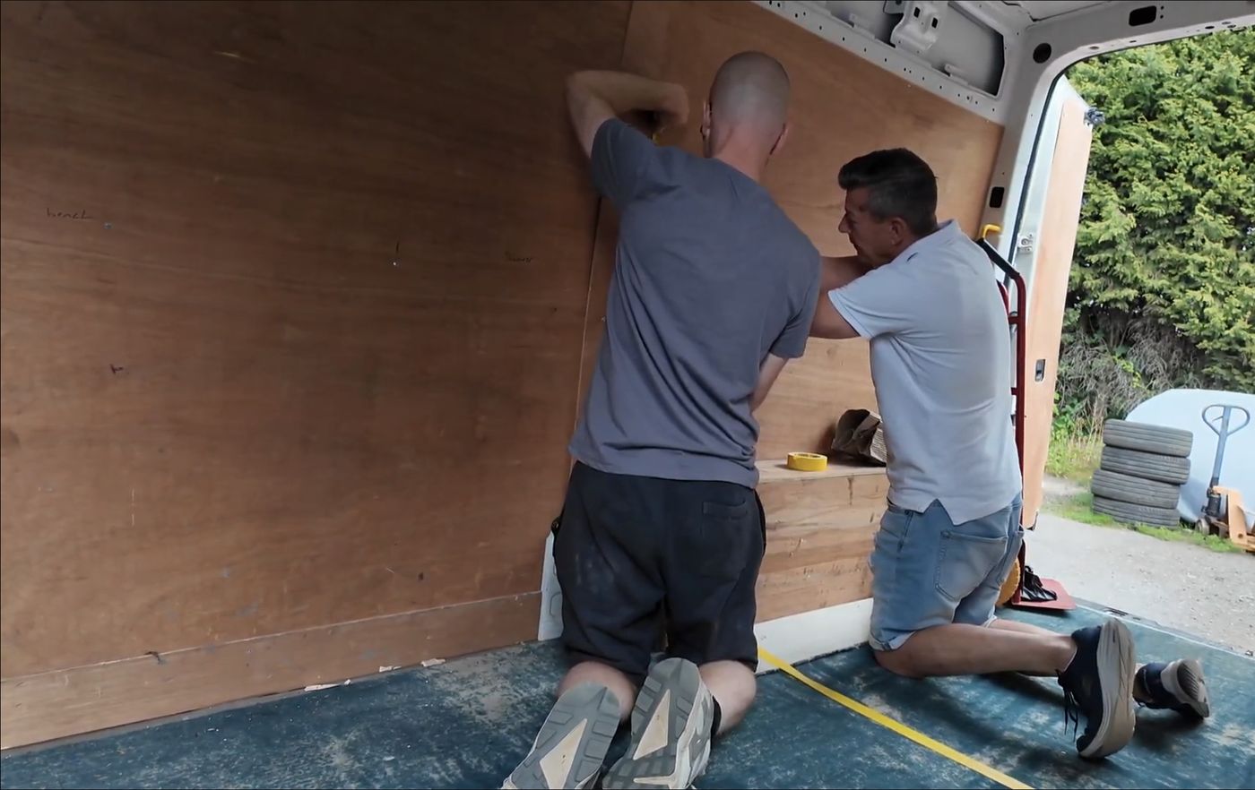 Two of the VANZ team lining out a van in the workshop